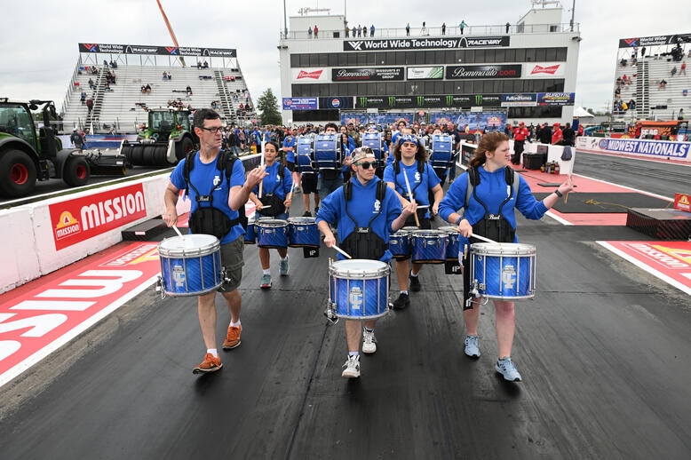 The marching band leads the Seal Master track walk