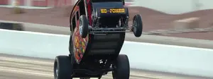 Ed "The Outlaw" Jones Stagecoach wheelstander put on a show at the Dodge NHRA Finals