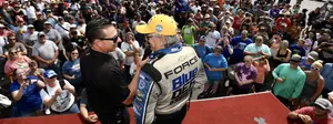 Why has John Force excelled at four-wide racing? 