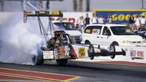 Second-generation Aussie nitro pilot Andrew Cowin showed the power and fury of a Top Fuel dragster by simultaneously wheelstanding and smoking the rear tires on this launch at the 1999 Phoenix event. 