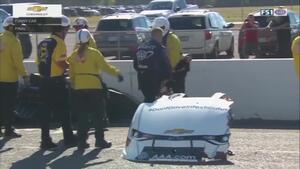 Co-crew chief Chris Cunningham diagnoses Robert Hight's Funny Car